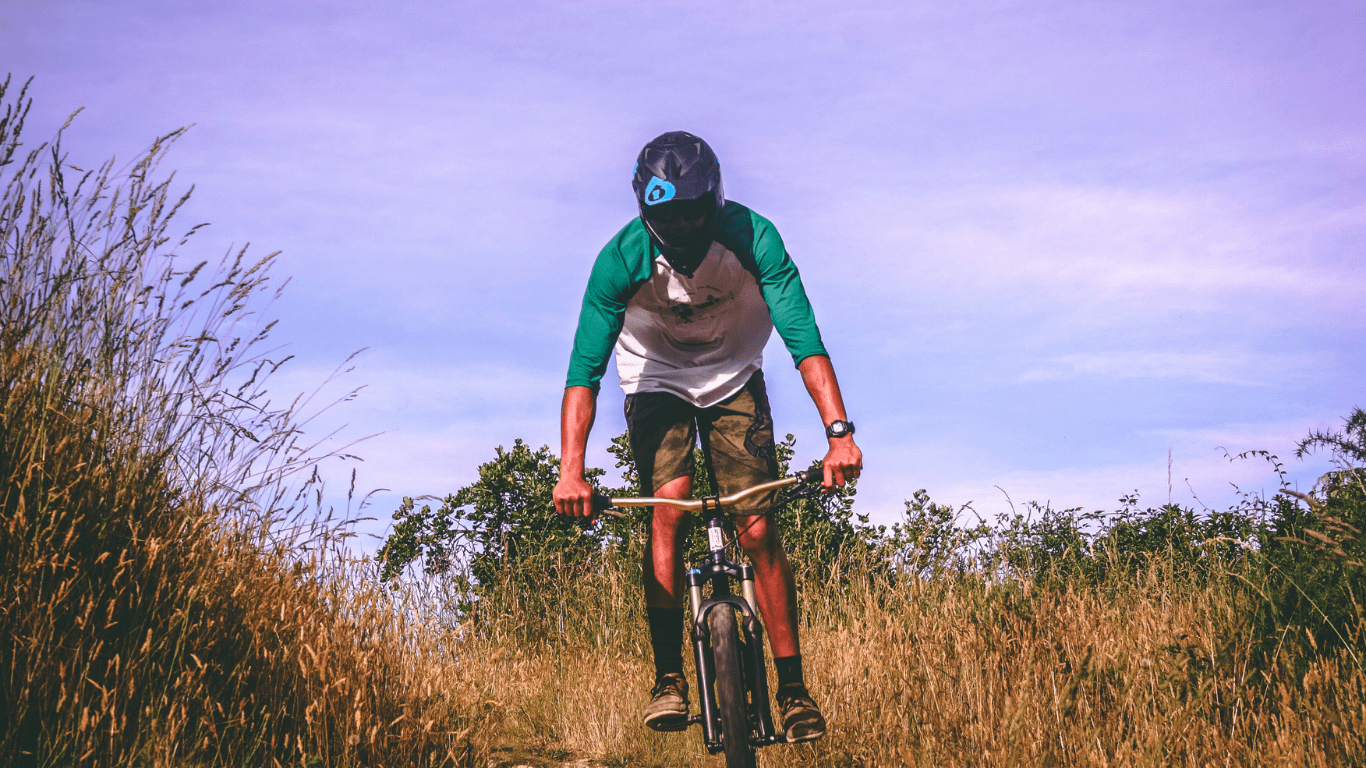 a man riding his bike in a trail