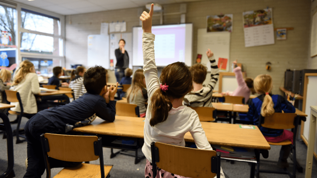 a classroom full of students and a teacher