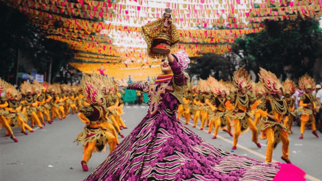 a women dancing in the middle of a festival